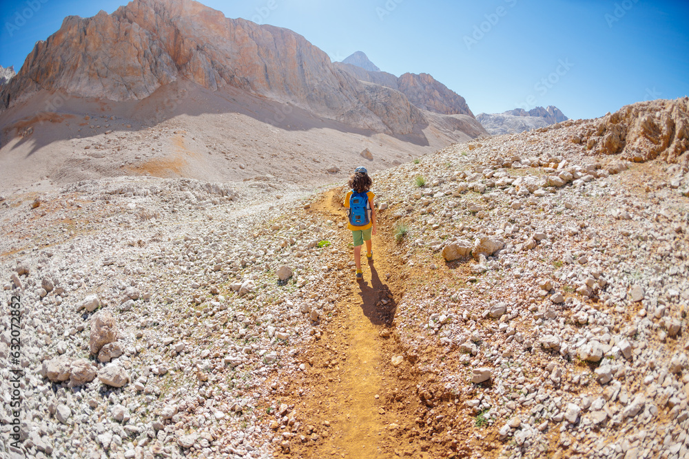 child travels in the mountains with a backpack. mountain hike in high mountains. Turkey. child travels in the mountains with a backpack. mountain hike in high mountains. Turkey.
