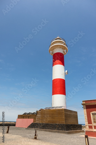 Faro del Tontón lighthouse on a sunny day with a cloudless blue sky. Fuerteventura, Canary Islands, Spain