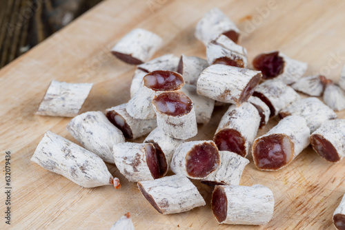 dried sausage with white mold cut into small pieces