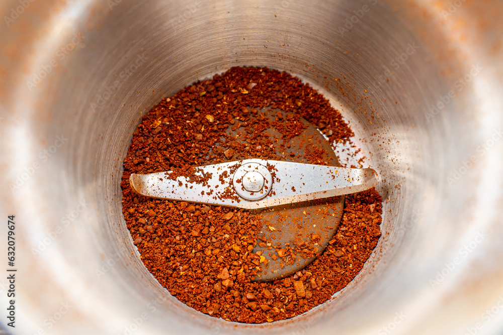 Half empty coffee grinder close-up. Coffee grinder glass with knives ...