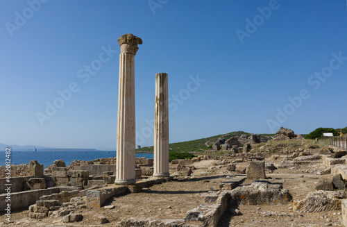 Ruins of ancient punic temple columns in Tharros, Sardinia with blue sky photo