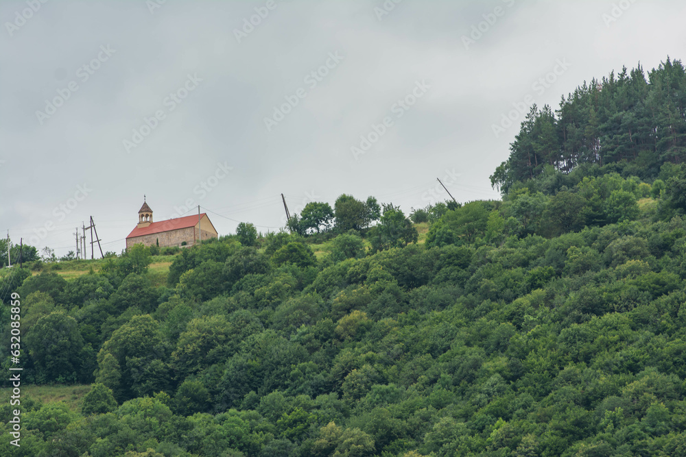 Church on top of the mountain. Green forests and monastery Church on top of the mountain. Green forests and monastery