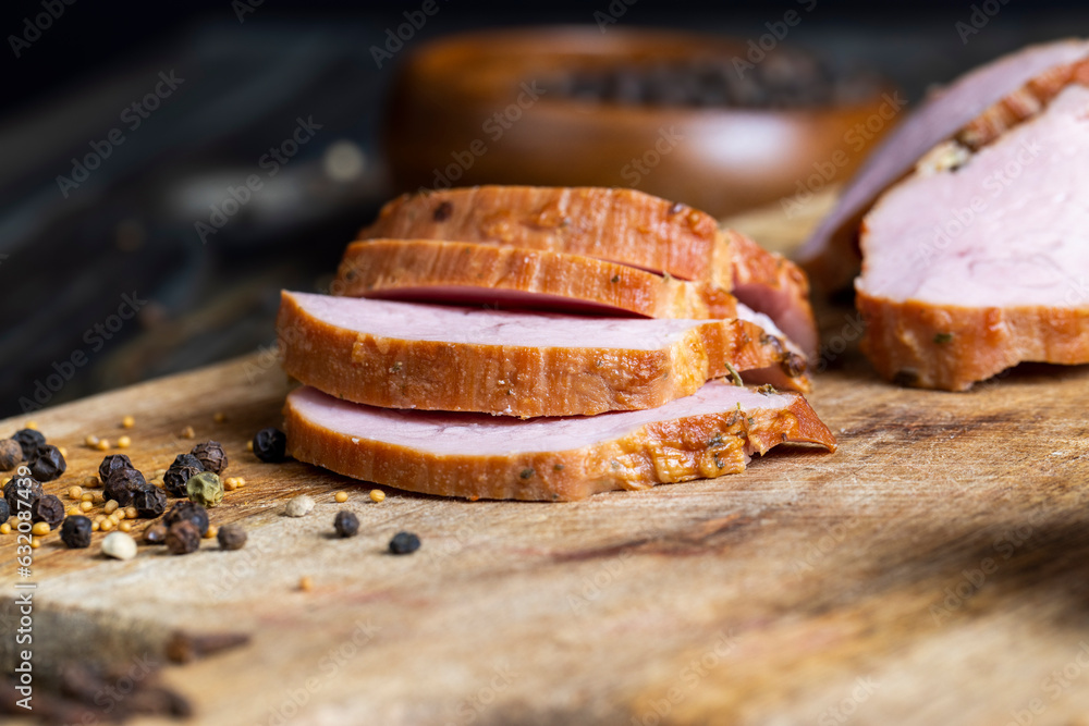 Cooked pork with spices on a board