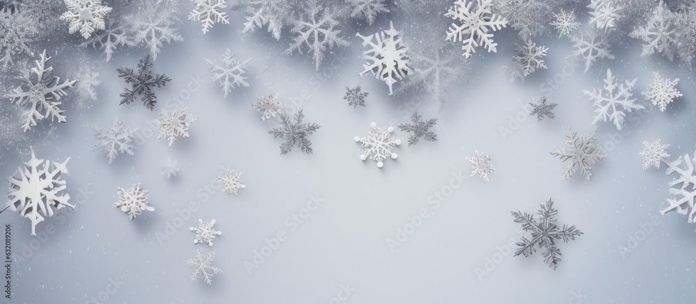 A Christmas picture made up of snowflakes on a pale gray background. Represents the winter season. Photographed from above with the frame laid out and room for text. A Christmas picture made up of snowflakes on a pale gray background. Represents the winter season. Photographed from above with the frame laid out and room for text.