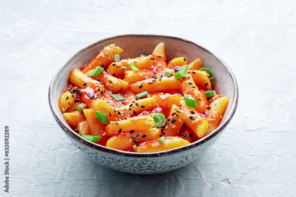 Tteokbokki or topokki, Korean street food, spicy rice cakes in red pepper gochujang sauce, a popular dish Tteokbokki or topokki, Korean street food, spicy rice cakes in red pepper gochujang sauce, a popular dish