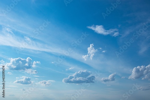 Bright blue sky with cumulus and cirrocumulus clouds, day  photo