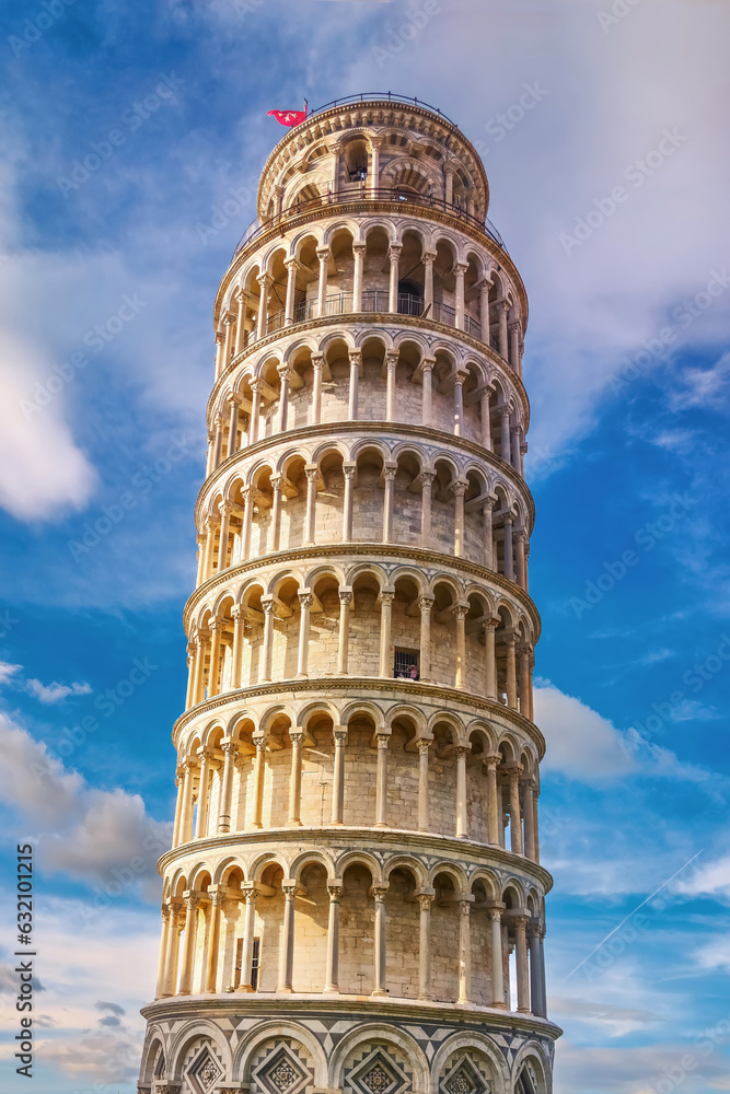 Pisa, Italy - May 17, 2023: The Leaning Tower of Pisa in Tuscany against the blue sky, one of the most recognizable and famous buildings in the world.