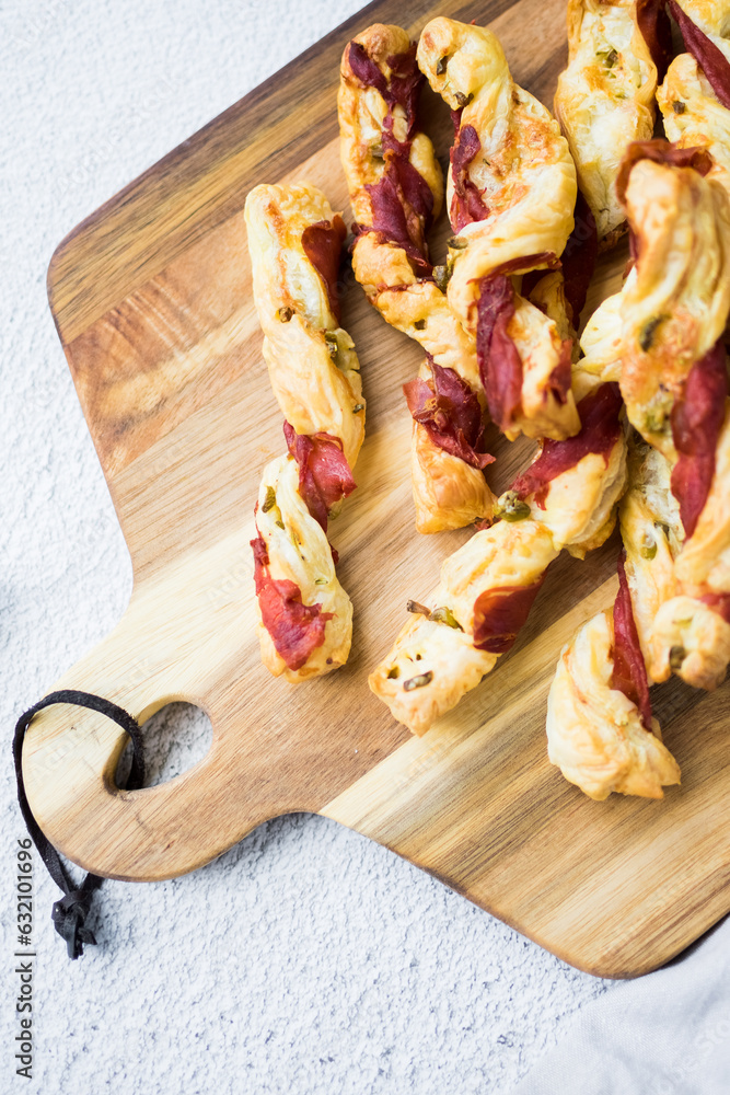 Puff pastry sticks. Close-up of puff pastry with prosciutto. Puff pastry sticks. Close-up of puff pastry with prosciutto.