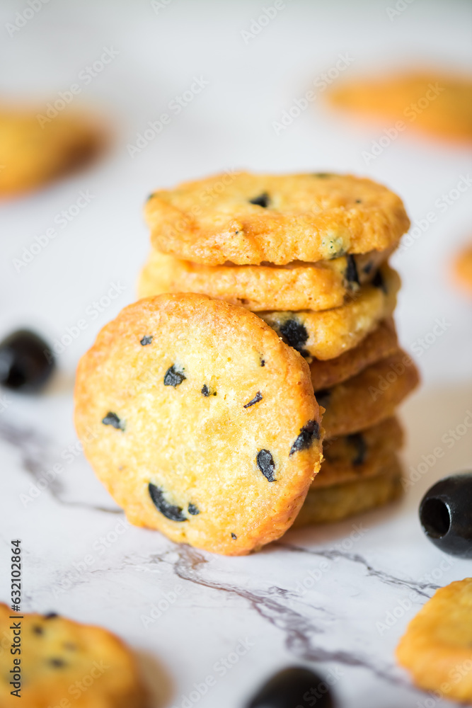Italian style round shortbread cookies with black olives and Parmesan cheese Italian style round shortbread cookies with black olives and Parmesan cheese