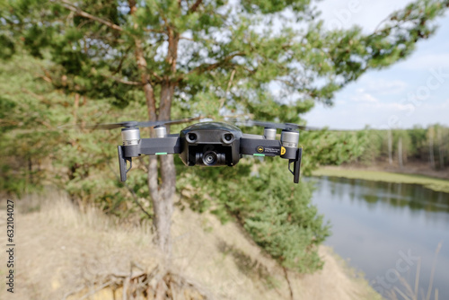 the drone is in the air. drone in the woods