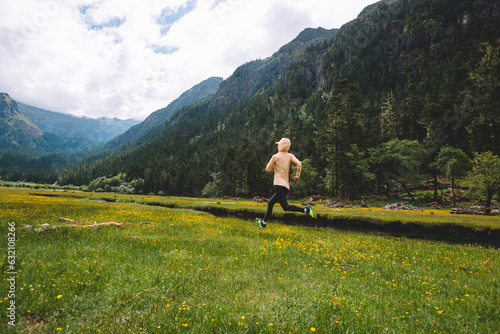 Woman trail runner cross country running in beautiful nature