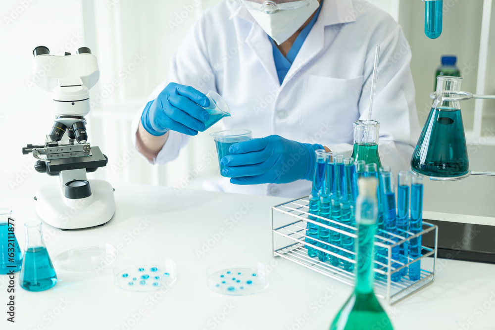 Fototapeta premium Medical Research Laboratory. Male scientist analyzing advanced science data for medical biotechnology development of microbiology laboratory researchers wearing gloves close-up image