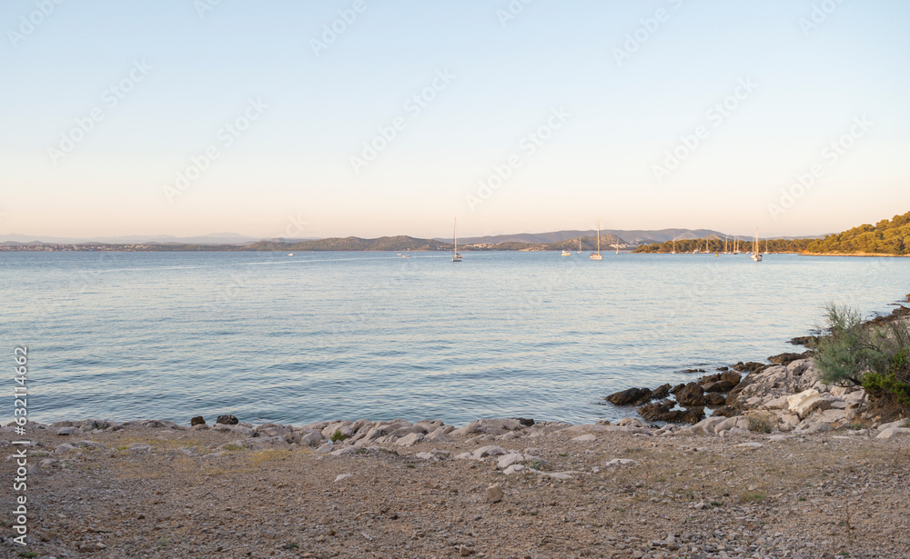 Fototapeta premium View from the island of Vrgada at sunset, Dalmatia, Croatia, sailboats, sea, coast