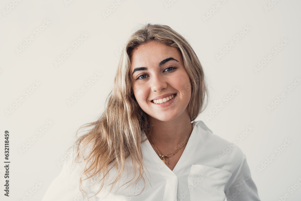 Close up overjoyed woman laughing, sitting on couch at home, head shot portrait young female chatting online with friends or relatives, looking at camera, having fun, making call or shooting video. Close up overjoyed woman laughing, sitting on couch at home, head shot portrait young female chatting online with friends or relatives, looking at camera, having fun, making call or shooting video.