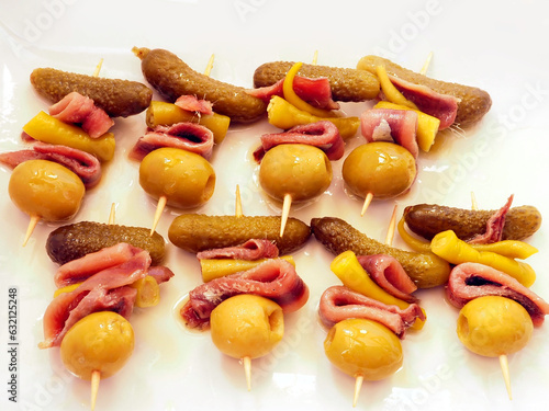 Gilda pinchos with olives, pepper and anchovies tapas from Spain photo