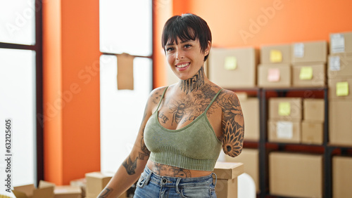 Fotografie Hispanic woman with amputee arm ecommerce business worker smiling confident stan