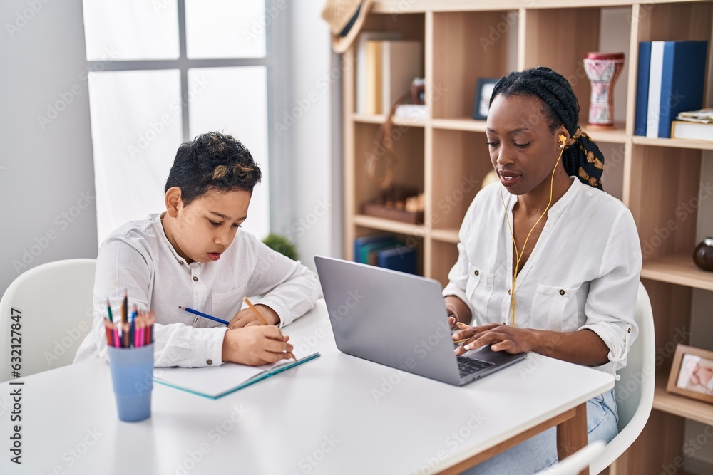 African american mother and son teleworking and studying at home African american mother and son teleworking and studying at home
