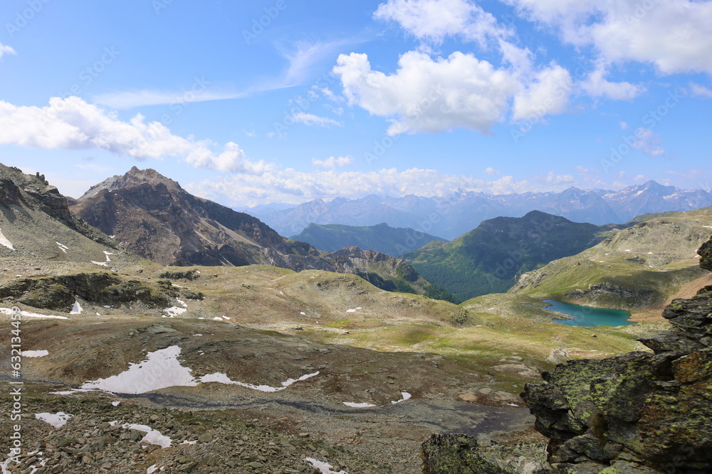 Mountain landscape on a hiking trail leading from Aosta valley to Luseney lake, in Saint Barthelemy valley, Italy Mountain landscape on a hiking trail leading from Aosta valley to Luseney lake, in Saint Barthelemy valley, Italy