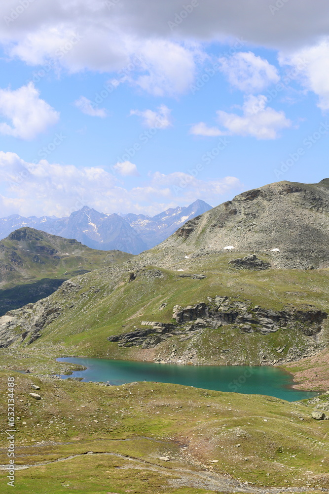 Mountain landscape on a hiking trail leading from Aosta valley to Luseney lake, in Saint Barthelemy valley, Italy
