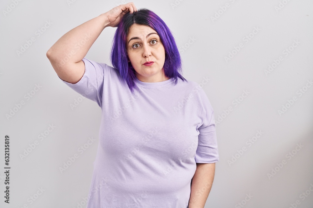 Plus size woman wit purple hair standing over isolated background confuse and wonder about question. uncertain with doubt, thinking with hand on head. pensive concept.
