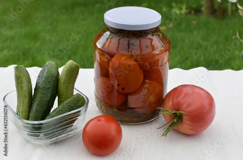 Salted tomatoes in a glass jar