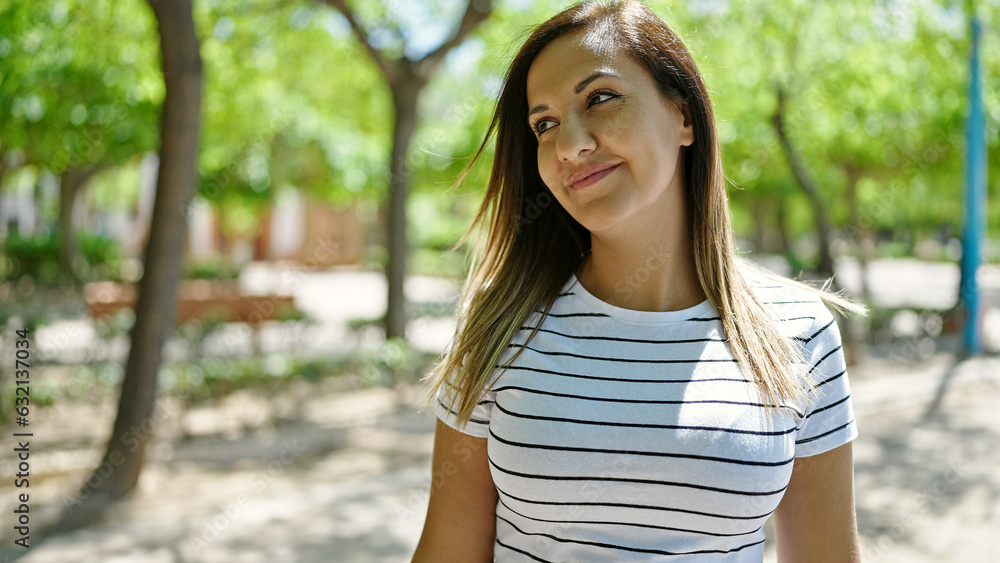 Middle eastern woman smiling confident looking to the side at park Middle eastern woman smiling confident looking to the side at park