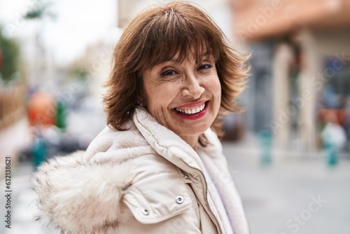 Middle age woman smiling confident standing at street © Krakenimages.com