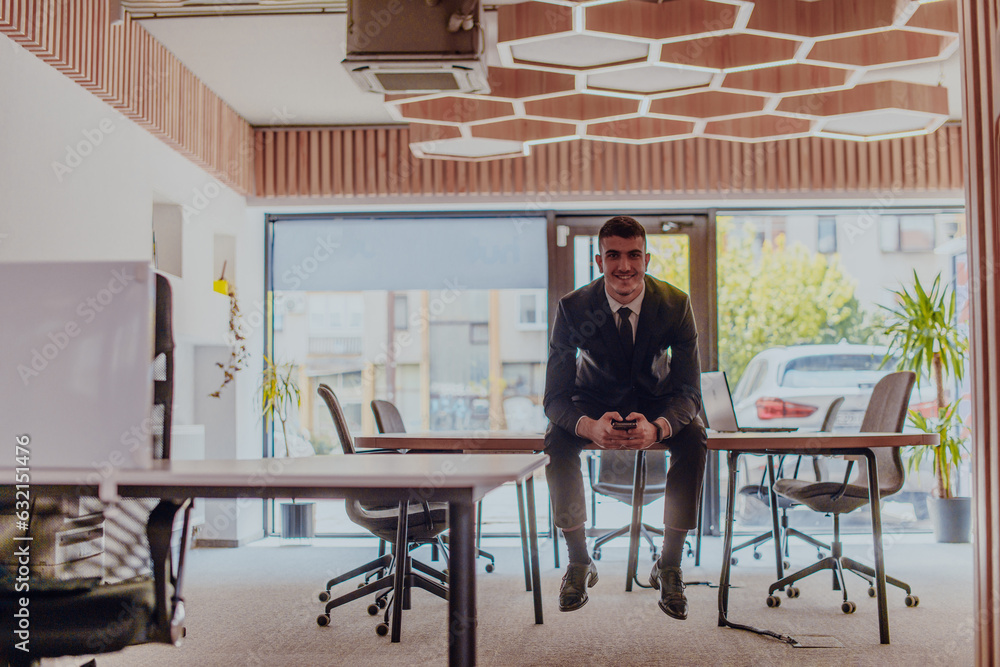 A businessman sitting on his desk, taking a moment to rest and unwind from a demanding workday, displaying a sense of tranquility and relaxation amidst the corporate environment A businessman sitting on his desk, taking a moment to rest and unwind from a demanding workday, displaying a sense of tranquility and relaxation amidst the corporate environment