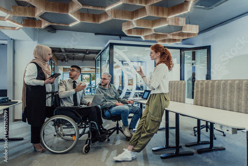 Young group of business people brainstorming together in a startup space, discussing business projects, investments, and solving challenges.