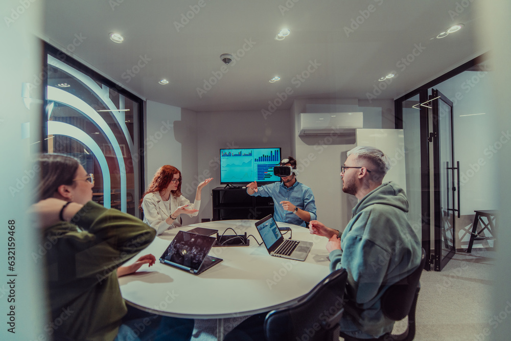 A diverse group of businessmen collaborates and tests a new virtual ...