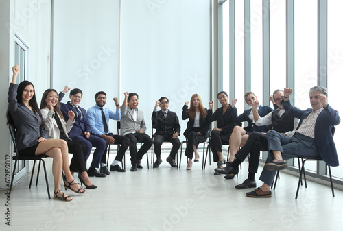 Business People Raising Hands, Young Men and Women Having Fun or Celebrating Success