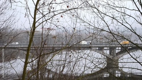 Wallpaper Mural cars drive along the city bridge over the river in winter Torontodigital.ca
