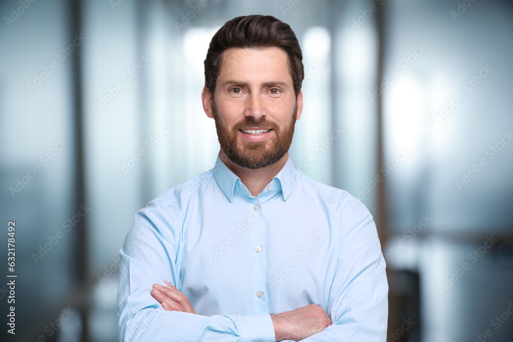 Portrait of handsome confident man in office Portrait of handsome confident man in office