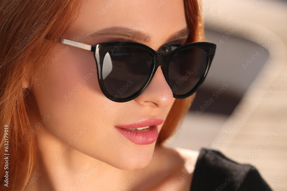 Beautiful woman in sunglasses outdoors on sunny day, closeup Beautiful woman in sunglasses outdoors on sunny day, closeup