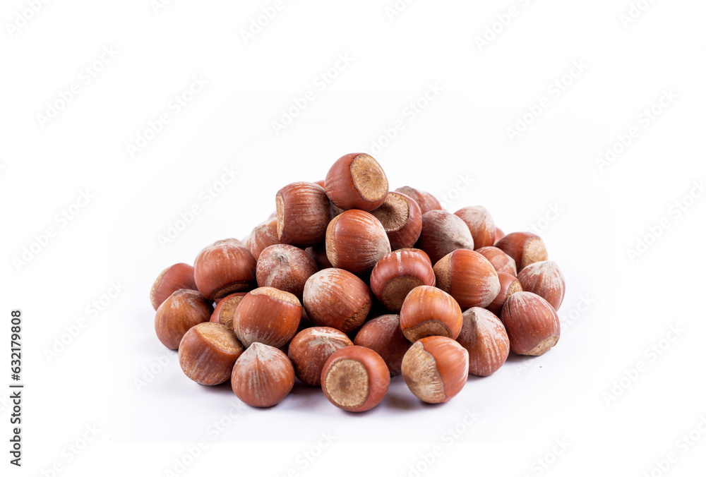 Shelled hazelnuts on the white background Shelled hazelnuts on the white background