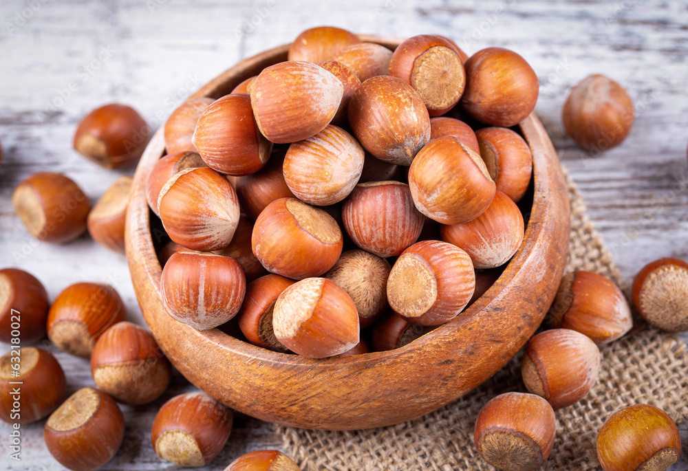 Shelled Hazelnuts is important for health on the wooden background Shelled Hazelnuts is important for health on the wooden background