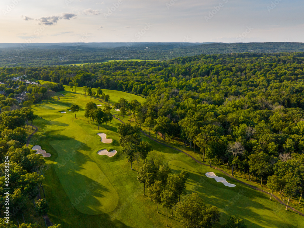 Obraz premium Aerial photo of a Golf Course in the mountains