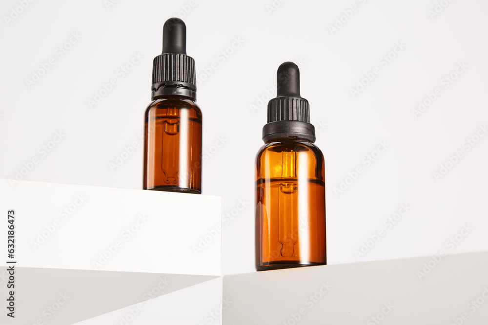 Dropper containers with pipettes on white background. Dropper containers with pipettes on white background.