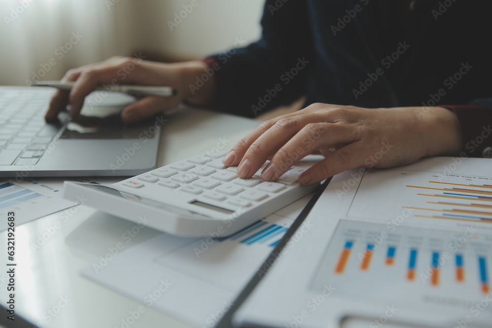 Unrecognizable businessman using calculator Unrecognizable businessman using calculator