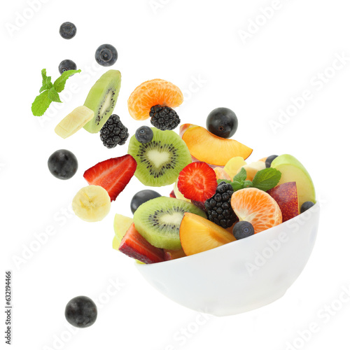 Fresh mixed fruits falling into a bowl isolated on white transparent background