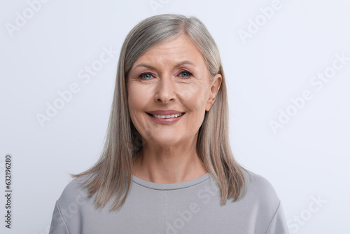 Portrait of beautiful senior woman on white background