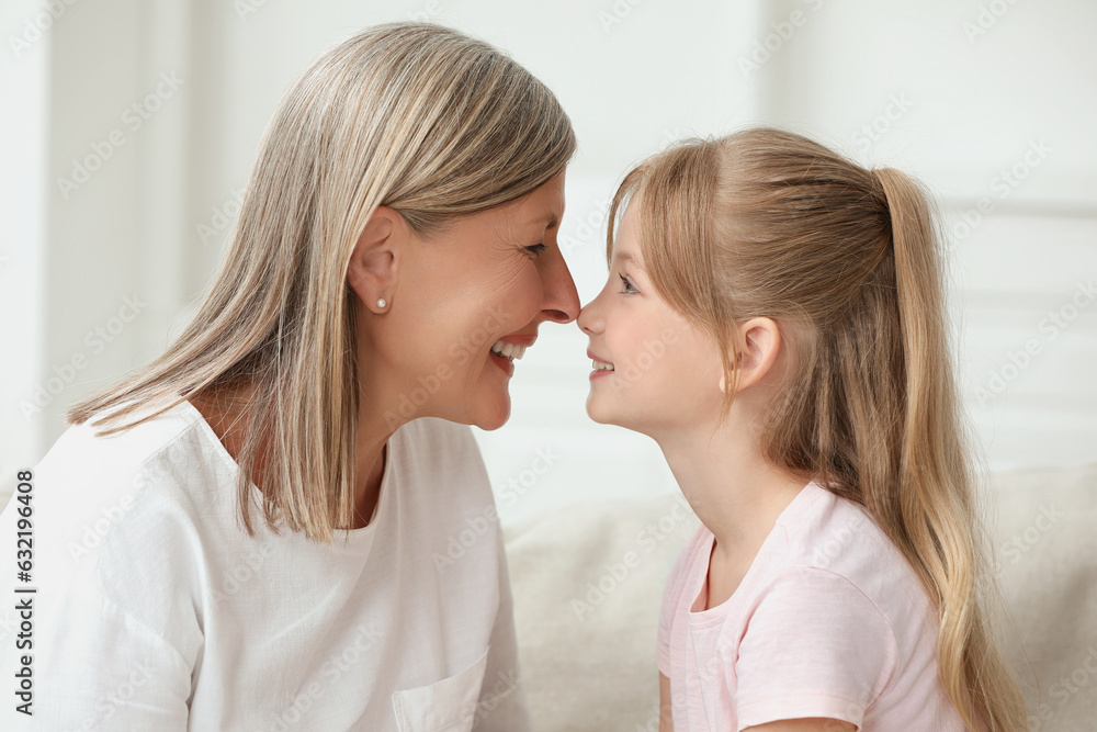 Happy grandmother with her granddaughter at home Happy grandmother with her granddaughter at home