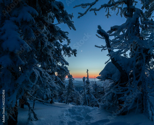 Jupiter, Venus and Moon Conjunction in a winter landscape