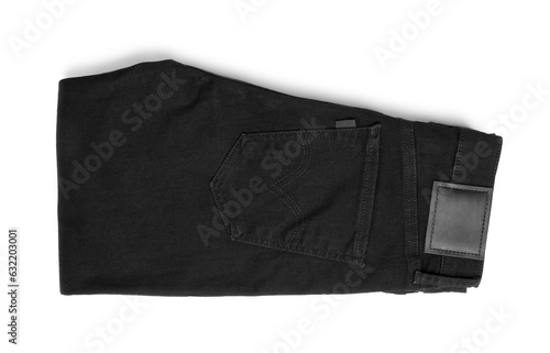 Folded black jeans isolated on white, top view