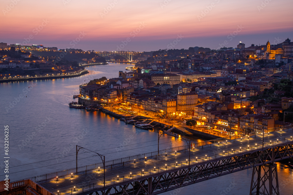 View to Porto over river Douro with reflection of the lights at night