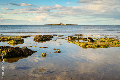 Low Hauxley Beach looks over Coquet Island, nestled in between Amble and Druridge Bay its popular with walkers and at low tide the sandy beach is quite wide photo