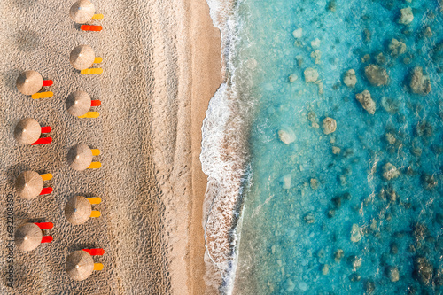 Aerial view of sea and umbrellas on the beach