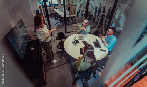 Tableau sur toile A group of young business entrepreneurs engages in a focused meeting, discussing