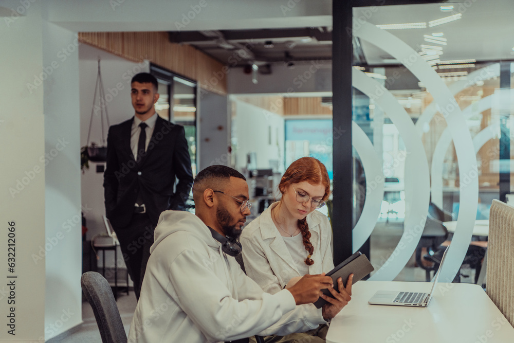 In a modern office setting, an African American businessman and his Muslim colleague, wearing a hijab, engage in collaborative discussions, tackling various business tasks and solving problems In a modern office setting, an African American businessman and his Muslim colleague, wearing a hijab, engage in collaborative discussions, tackling various business tasks and solving problems