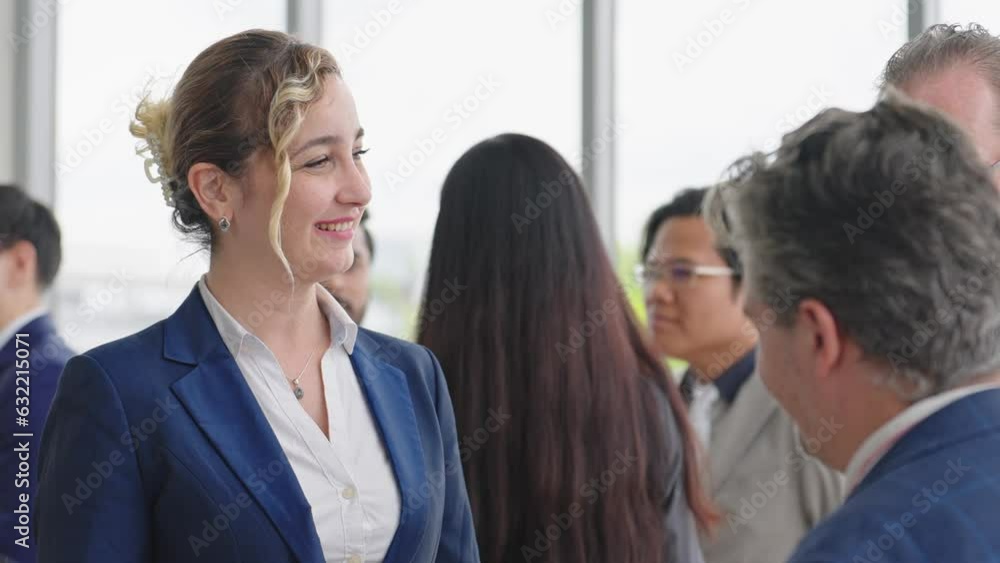 Caucasian man leader introducing woman manager to new team partner at seminar of company. Male leader introducing woman manager shaking hands welcoming newcomer Caucasian man leader introducing woman manager to new team partner at seminar of company. Male leader introducing woman manager shaking hands welcoming newcomer